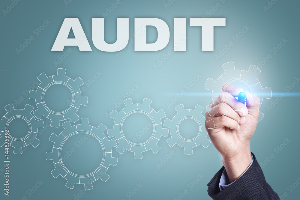 Businessman drawing on virtual screen. audit concept Businessman drawing on virtual screen. audit concept