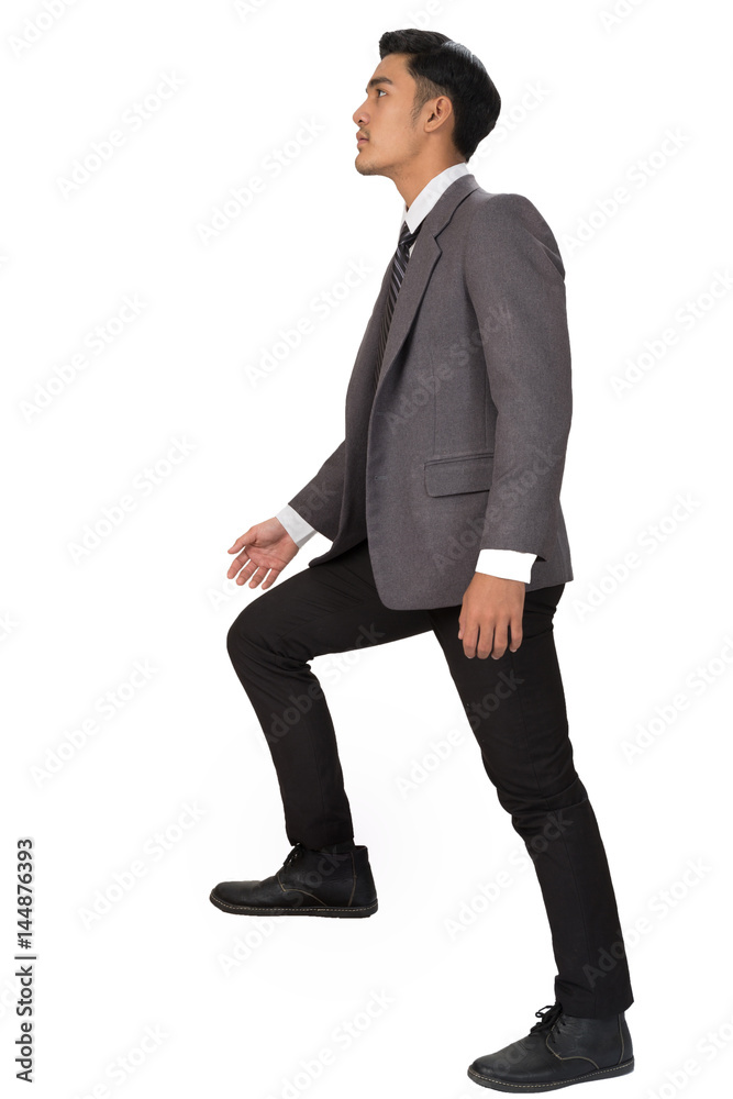 Ambitions concept with businessman climbing stairs Ambitions concept with businessman climbing stairs