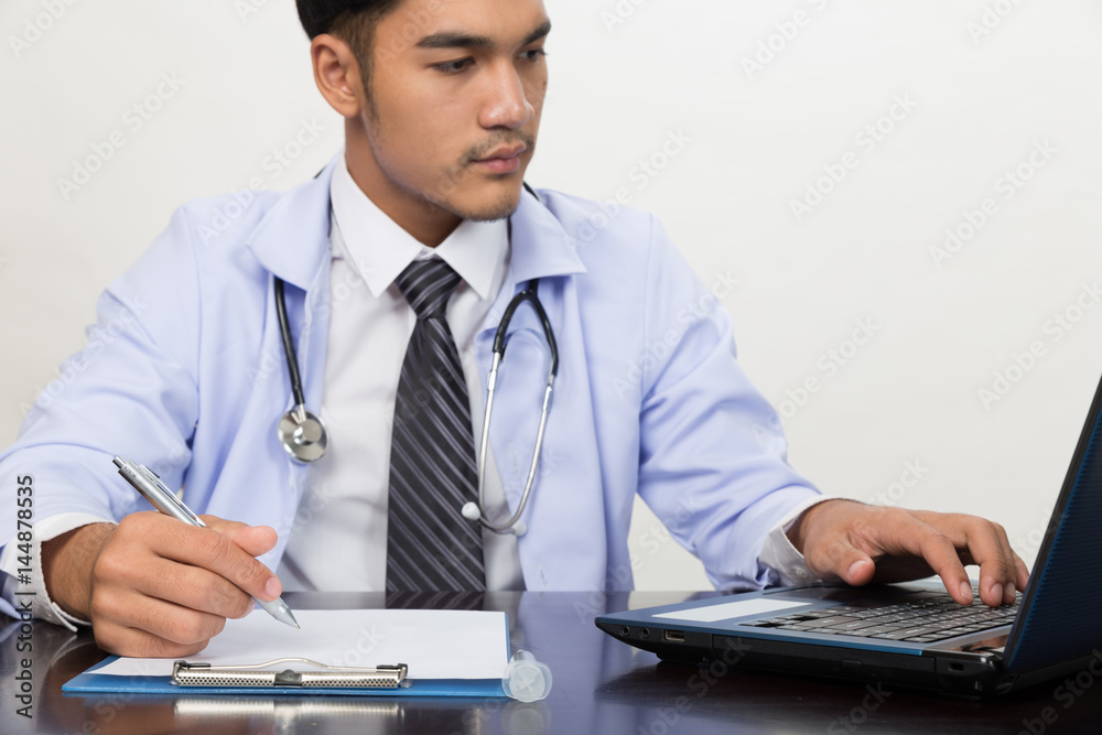 doctor writing RX prescription in medical office clinic on desk, stethoscope with clipboard doctor writing RX prescription in medical office clinic on desk, stethoscope with clipboard
