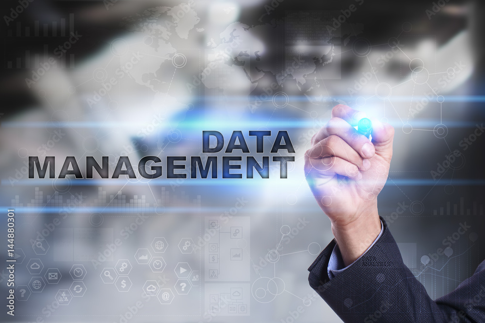 Businessman is drawing on virtual screen. data management concept. Businessman is drawing on virtual screen. data management concept.
