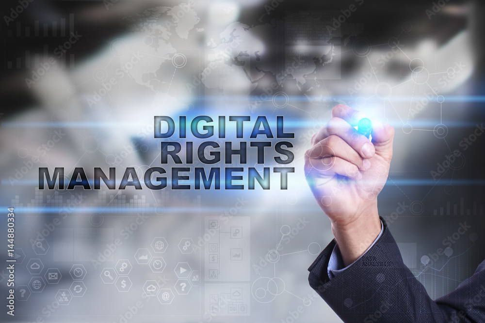 Businessman is drawing on virtual screen. digital rights management concept. Businessman is drawing on virtual screen. digital rights management concept.