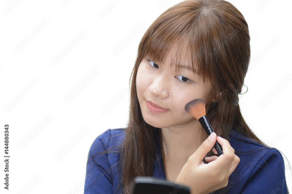 beautiful model applying professional make up using a brush isolate on white background beautiful model applying professional make up using a brush isolate on white background
