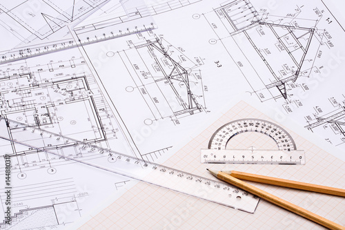 Workplace of architect. Architectural design, sketch, drawing paper, drawings, simple pencil, transparent ruler with protractor on the table