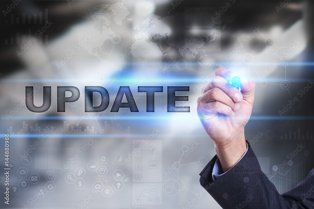 Businessman is drawing on virtual screen. update concept. Businessman is drawing on virtual screen. update concept.