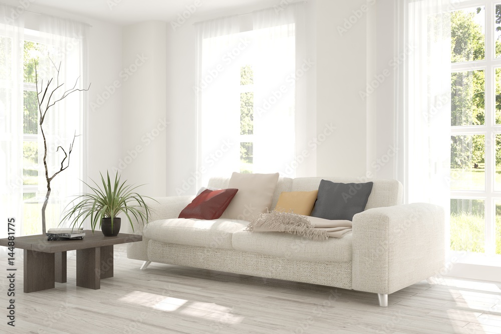 Fototapeta premium White room with sofa and green landscape in window. Scandinavian interior design. 3D illustration