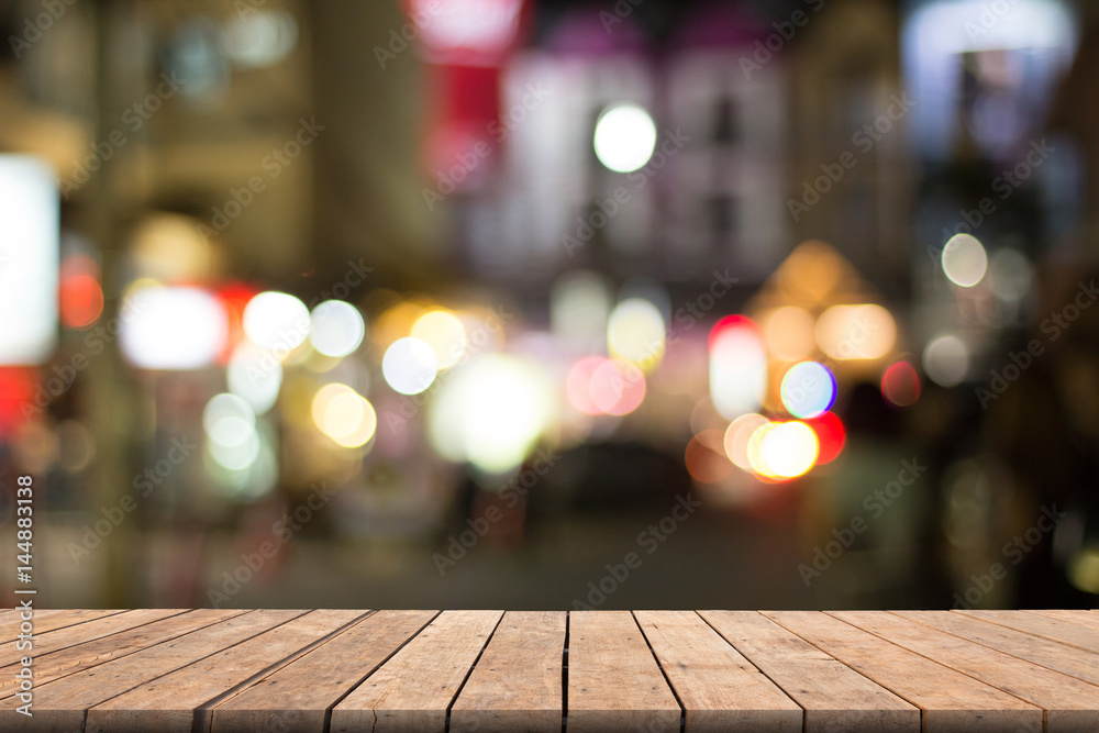 Colorful bokeh blurred background on wooden table