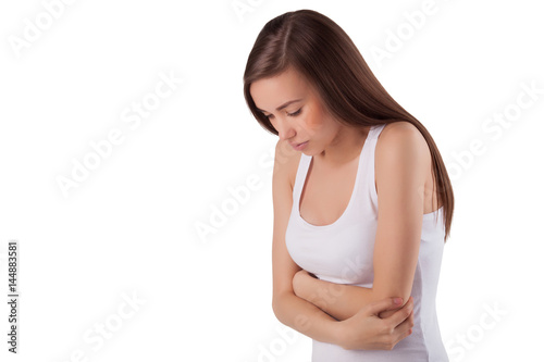 Pretty young girl having a stomachache. Sad woman.