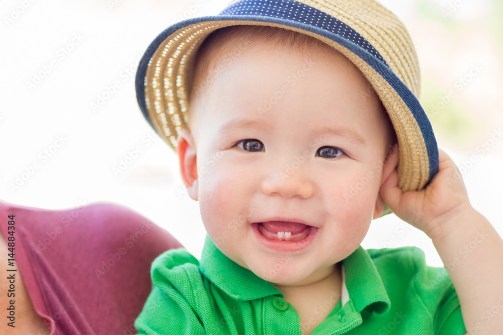Portrait of A Happy Mixed Race Chinese and Caucasian Baby Boy Wearing His Hat Portrait of A Happy Mixed Race Chinese and Caucasian Baby Boy Wearing His Hat