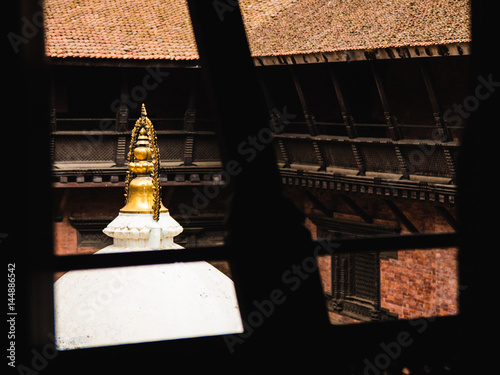 Looking out at the stupa in Mani Keshar Chowk (one of the many beautiful courtyards) in Patan's Durbar Square, Nepal. photo