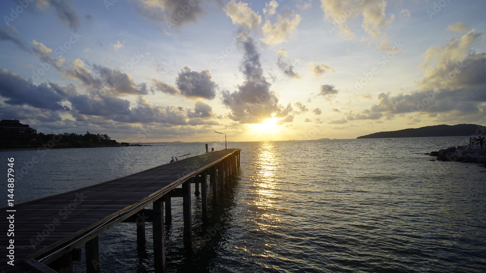 Wooden walkway bridge along the beach,Beach, rocky beach, beautiful beach, wooden bridges, wooden bridges along the beach, Koh Kham, Kham island, Sattahip, Chonburi, Thailand.