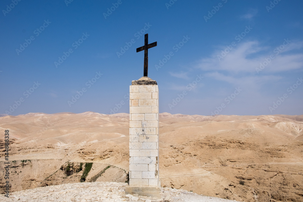 Cross pointing to St George Orthodox Monastery, located in Wadi Qelt, Israel Cross pointing to St George Orthodox Monastery, located in Wadi Qelt, Israel