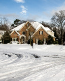 Beautiful estate home with snow covered roads