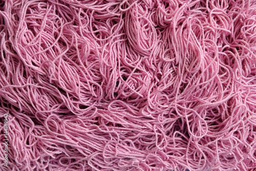 Background of tangled pink thread