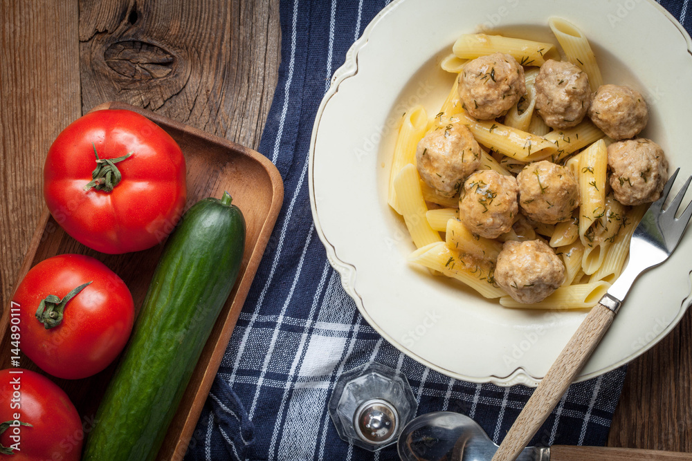 Pork meatballs with dill sauce and pasta. Selective focus. Pork meatballs with dill sauce and pasta. Selective focus.