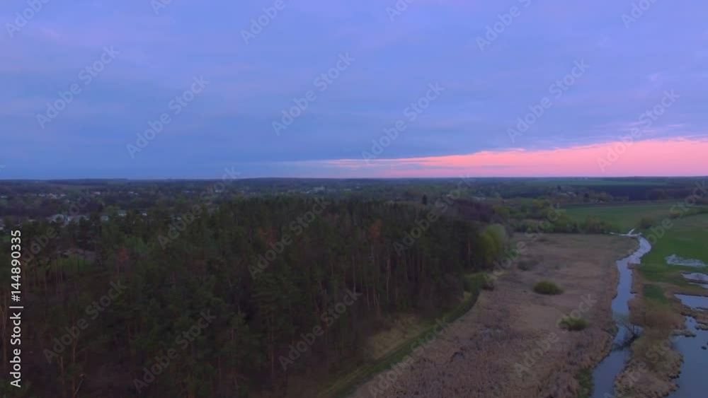 Aerial View. Flying over the River near pine forest Aerial View. Flying over the River near pine forest