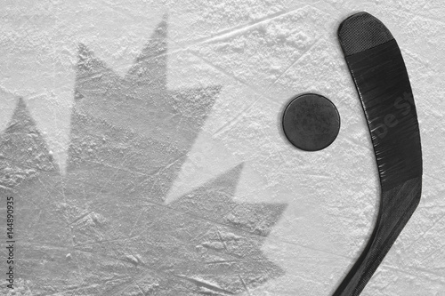The image of the Canadian flag and hockey puck with the stick