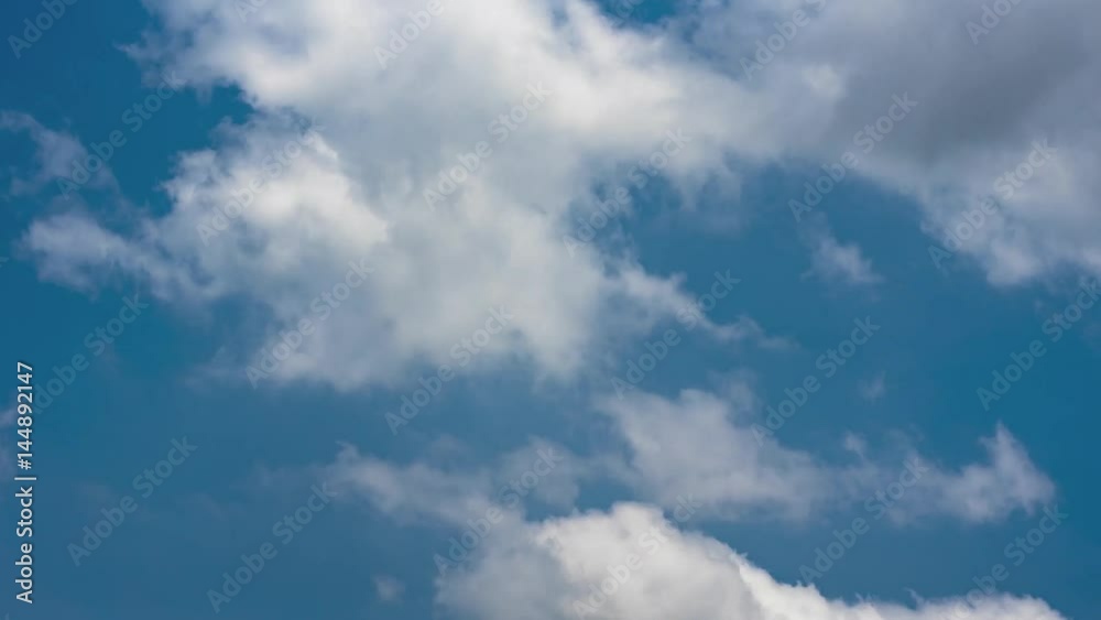 Clouds moving fast time lapse - going from blue sky and white clouds to dark rain clouds Clouds moving fast time lapse - going from blue sky and white clouds to dark rain clouds