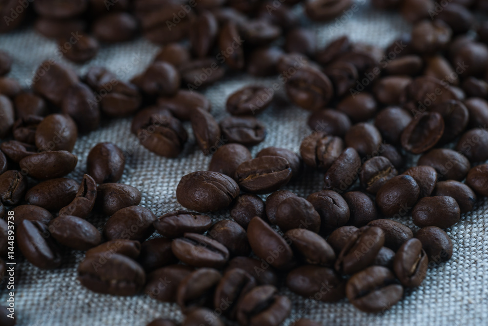 Coffee beans on wood background Coffee beans on wood background
