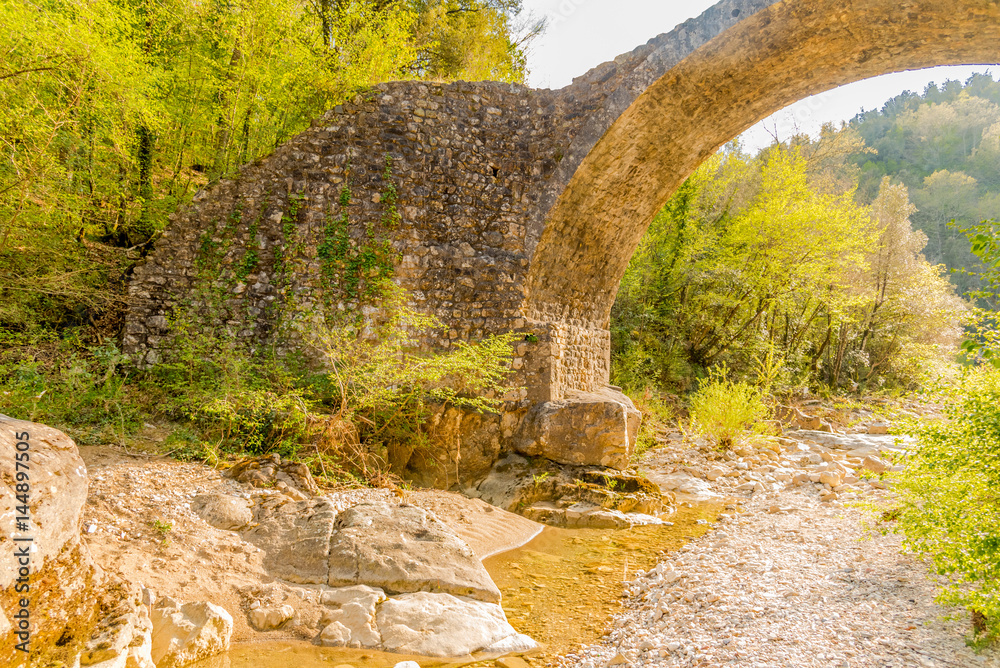 Ancient medieval stone bridge in siena in tuscany