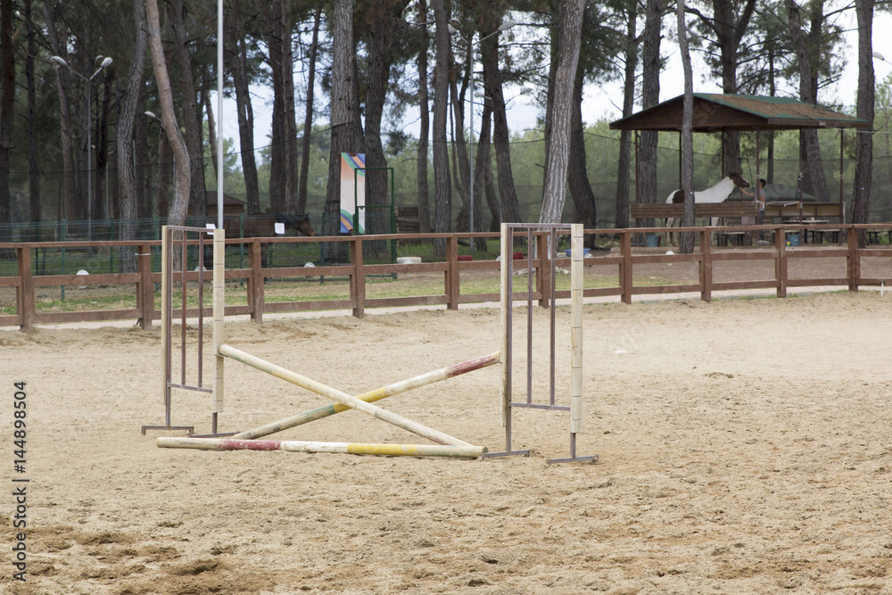 horse jump poles stands on a horse farm