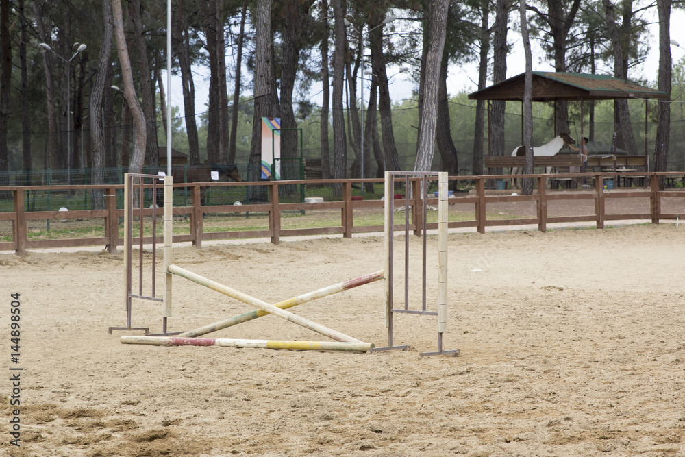 horse jump poles stands on a horse farm horse jump poles stands on a horse farm