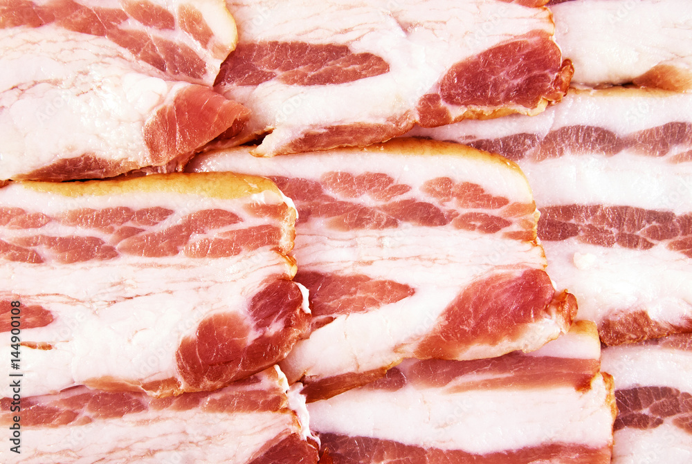 Bacon background. Top view of slices with pork meat and fat. Bacon background. Top view of slices with pork meat and fat.