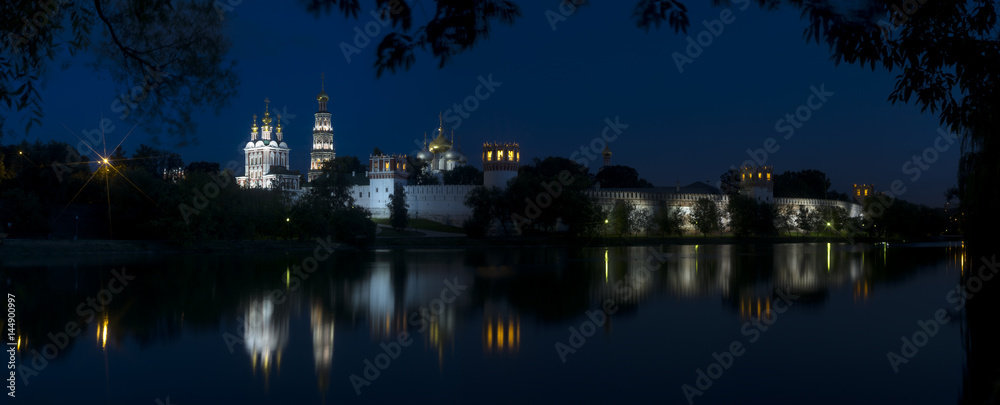 Novodevichy convent, night summer landscape panorama on coast of lake