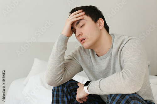 Tired young man with sleep ...