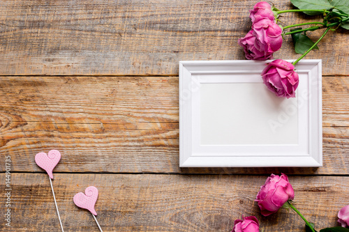 Mother's day gift with peony flowers and frame top view mockup
