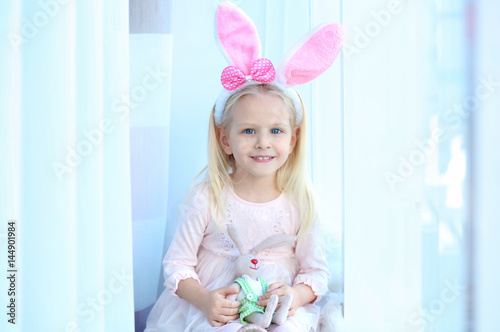Cute little girl with bunny...