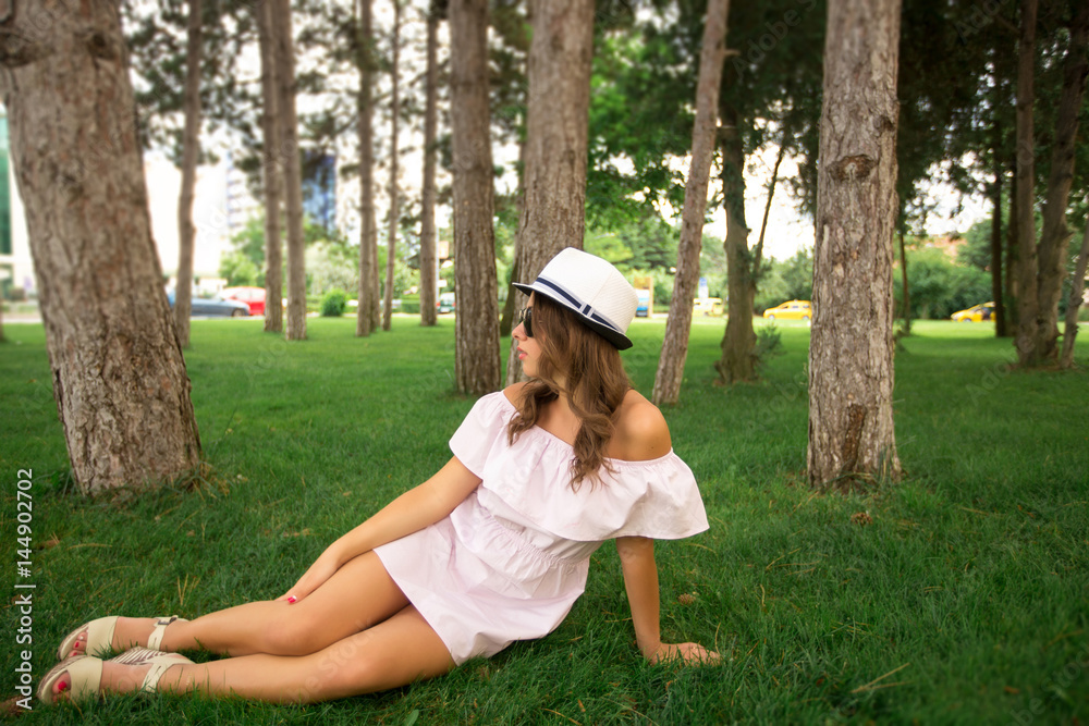 Beautiful girl in the park. Green grass and sunny weather
Beautiful girl in the park. Green grass and sunny weather