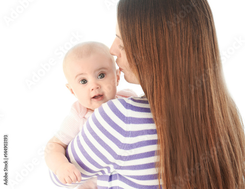 Adorable baby with mother o...