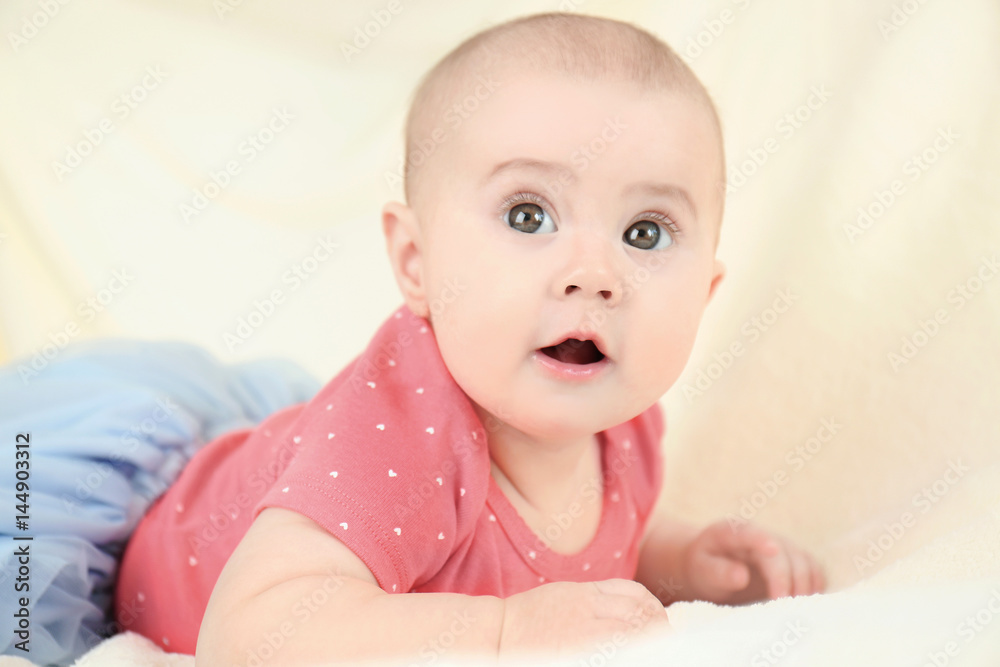 Portrait of adorable baby in tulle skirt on light background Portrait of adorable baby in tulle skirt on light background