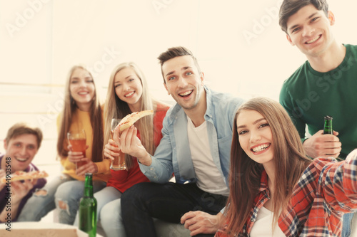 Friends taking selfie while...
