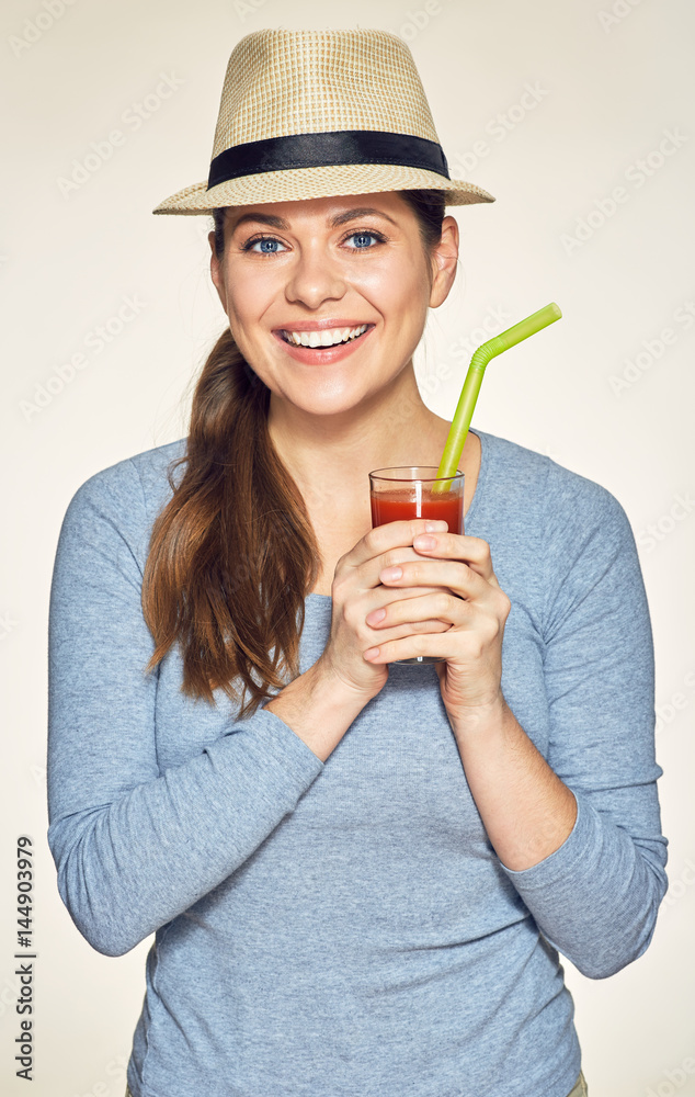 Young woman holding glass with vitamin drink. Young woman holding glass with vitamin drink.