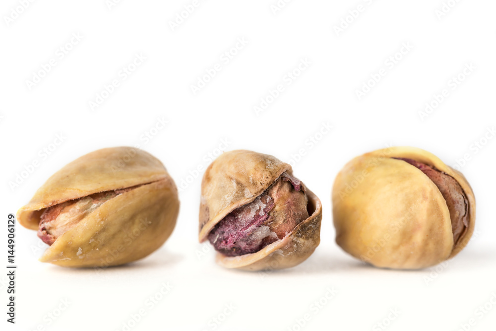 Pistachio nuts. Isolated on a white background Pistachio nuts. Isolated on a white background