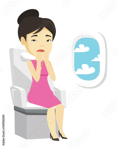 Young woman suffering from fear of flying.