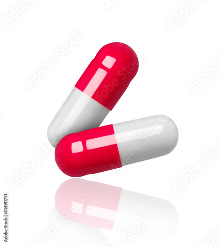 close-up of two medical capsules isolated on white background