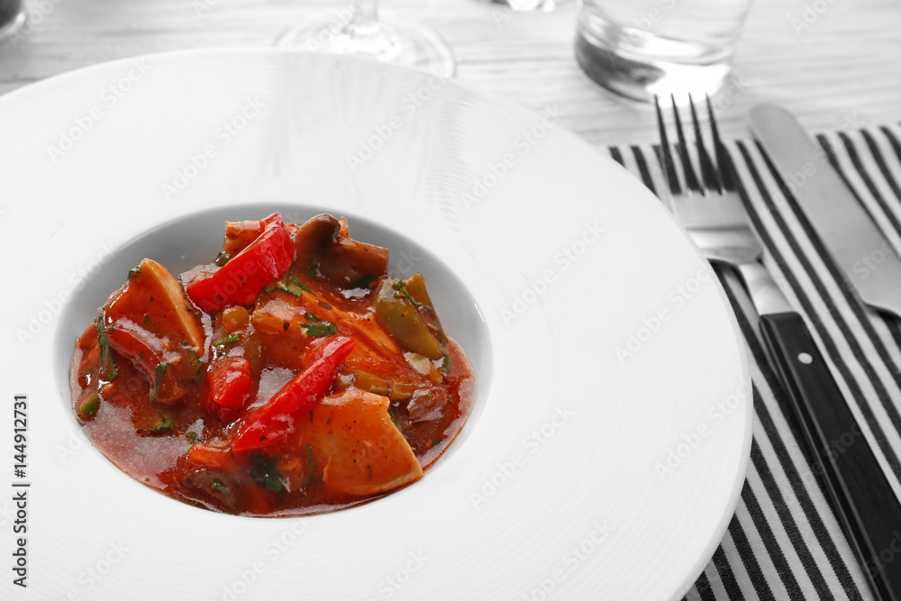 Plate with tasty chicken cacciatore on table Plate with tasty chicken cacciatore on table