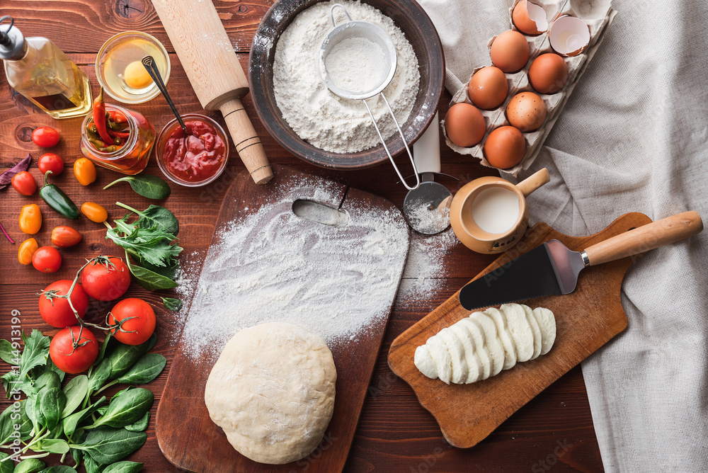 Step-by-step boss makes a pizza margarita. Dough and pizza ingredients Step-by-step boss makes a pizza margarita. Dough and pizza ingredients