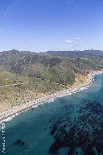 Aerial view of mountains, ocean kelp and Pacific Coast Highway north of Malibu in Southern California. © trekandphoto