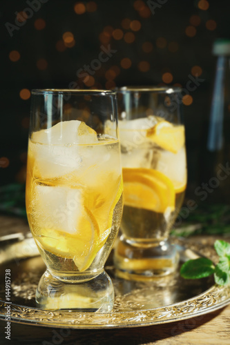 Glasses with delicious wine spritzer on silver tray