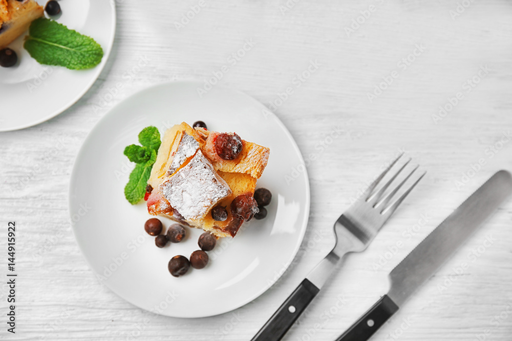 Delicious bread pudding with berries on wooden table Delicious bread pudding with berries on wooden table