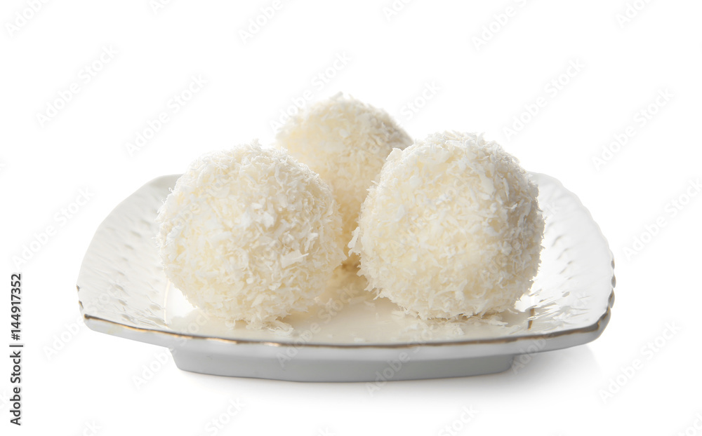 Plate with coconut candies on white background Plate with coconut candies on white background