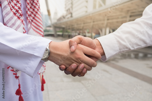 Co-Business and Co-worker partners Successful businessman shaking hands Concept