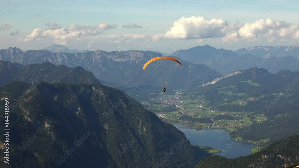 Skydiver or Paraglider over Austrian Alps Mountains. 4K 