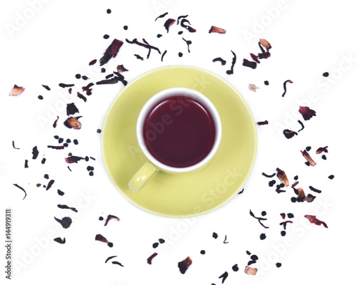 Wild berry tea in green cup with hibiscus leafs isolated on white background