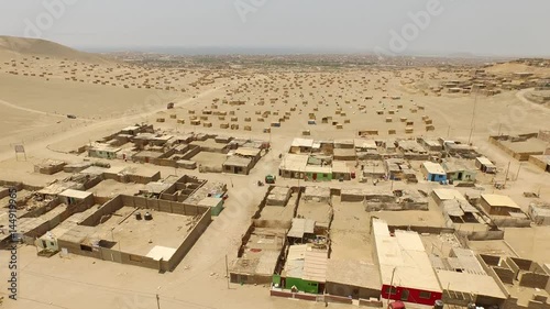 Aerial of land occuption in Peru, here in Huacho in the desert photo