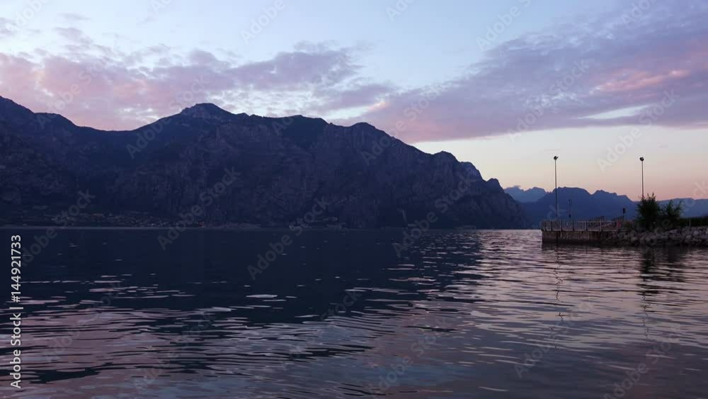 Sunset on the Garda Lake between Mountais, Italy. 4K Sunset on the Garda Lake between Mountais, Italy. 4K