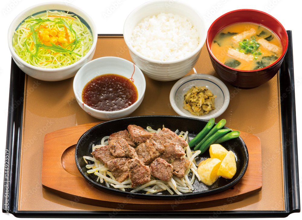 Bento of beafsteak with rice and seaweed soup on table Bento of beafsteak with rice and seaweed soup on table